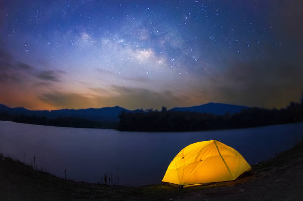 istock Yellow tent under Milky way 1327563421