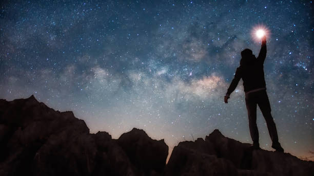 istock Silhouette man and Milky way 1327563422