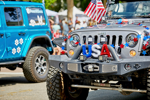 Prescott, Arizona, USA - July 3, 2021: Decorations on the front of a silver jeep in the 4th of July parade