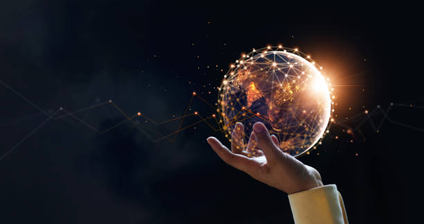 istock Businessman holding night earth and global networking connection and data exchanges, global communication network concept, Elements of this image furnished by NASA. 1327567701
