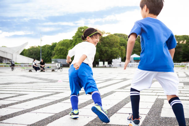 istock Kids soccer player playing foot race. 1327567932