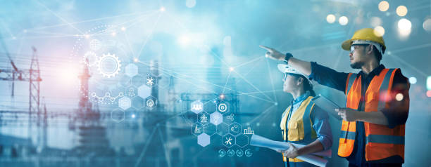 Male and female industrial engineers using tablet computer and blueprints checking and analysis data of power plant station project on network background. Male and female industrial engineers using tablet computer and blueprints checking and analysis data of power plant station project on network background. vitals stock pictures, royalty-free photos & images