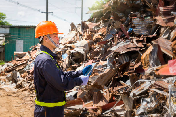 istock Engineer and recycle. Engineers standing in recycling center. Male foreman wearing protective equipments and holding tablet. 1327572949