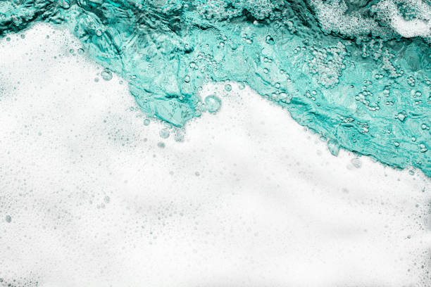 istock Blue sea water white foam texture background closeup, foamy ocean wave pattern, aqua bubbles surface, swimming pool backdrop, abstract summer sunny beach wallpaper, decorative frame border, copy space 1327573862