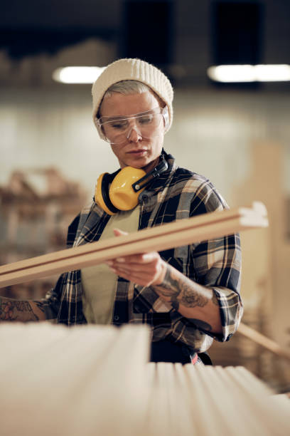 istock Hipster woman working with wood 1327574887