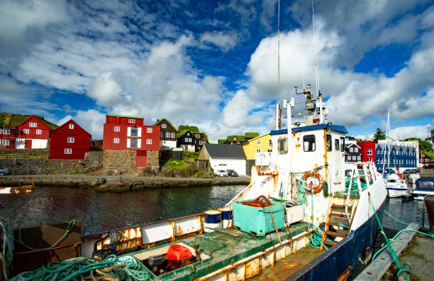 istock Rusted fishing boat in harbor 1327574900