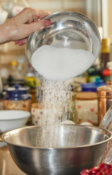 istock The chef pours sugar into a bowl for cherry pie, clafoutis. Step by step recipe 1327576572