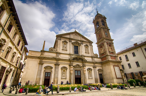 Milan, Italy; 12 May 2017. People seat in front of Church of Santuario di San Bernardino alle Ossa in Milan Italy