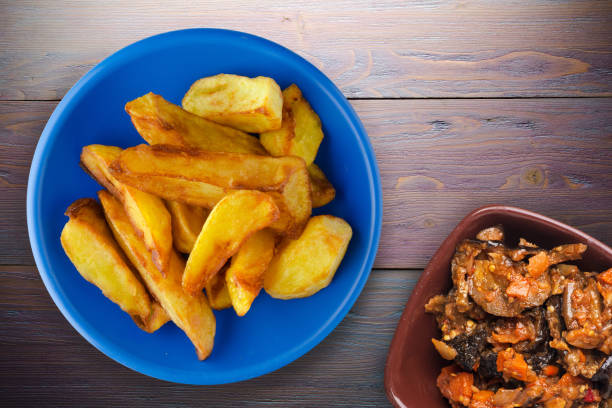 istock fry potatoes on a wooden background 1327583116