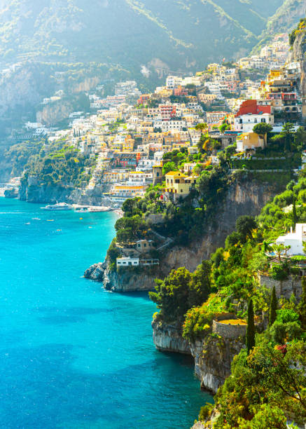 Morning view of Positano cityscape, Italy Morning view of Positano cityscape on coast line of mediterranean sea, Italy sorrento italy photos stock pictures, royalty-free photos & images