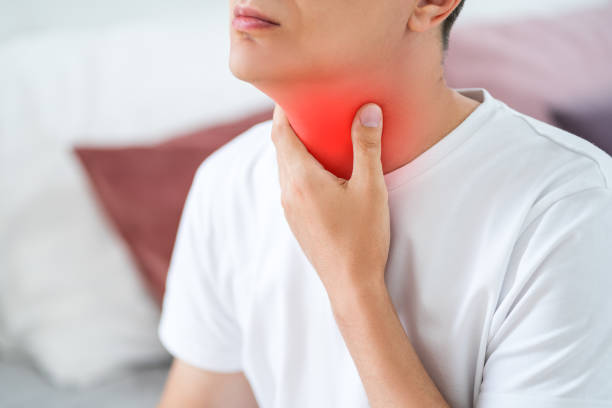 sore throat, men with pain in neck in home interior - surprise color image gasping the human body imagens e fotografias de stock