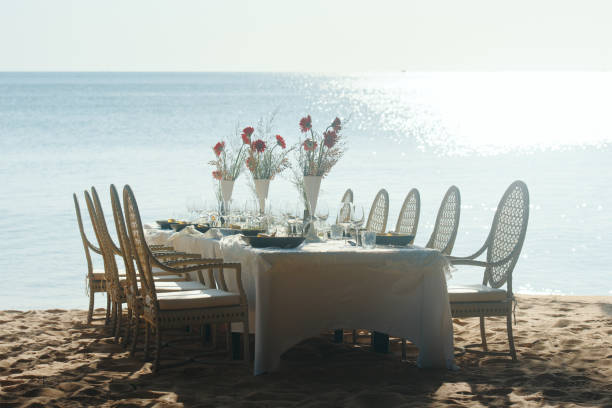 istock Festive serving table on beach in sunny day. 1327587816