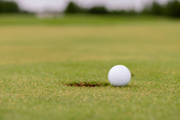 istock golf ball on green grass 1327589031