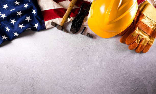istock Happy Labor day concept. American flag with different construction tools on dark stone background. 1327589156