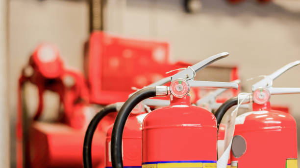 istock The red fire extinguisher is ready for use in case of an indoor fire emergency. 1327592133