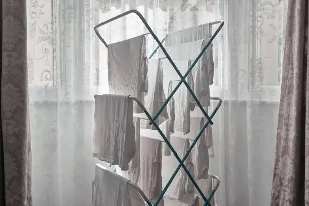 Photo of White Laundry Hangs on a Clothes Airer