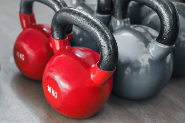 istock Red  Iron Kettlebell Weight On Wooden Floor 1327592742