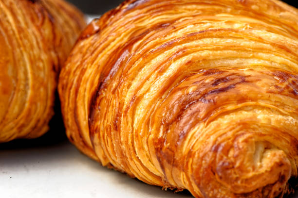 istock Close-up with fresh golden croissants on a plate 1327596439