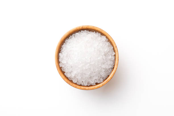 Salt in wooden bowl Salt granule photos stock pictures, royalty-free photos & images
