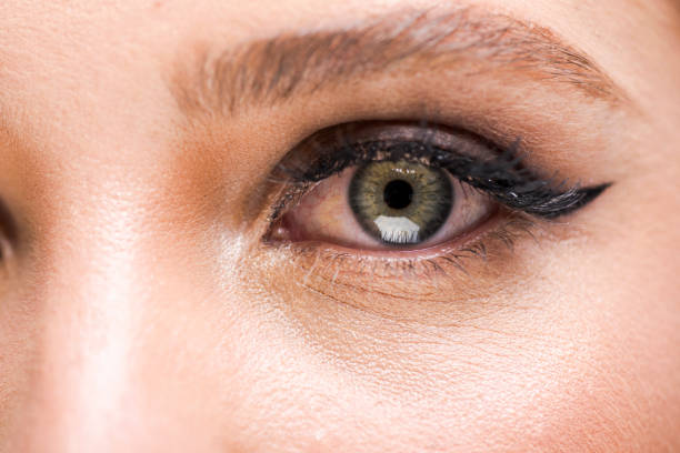 istock Extreme close-up womans eye with smokey eyeshadow looking into camera 1327600317