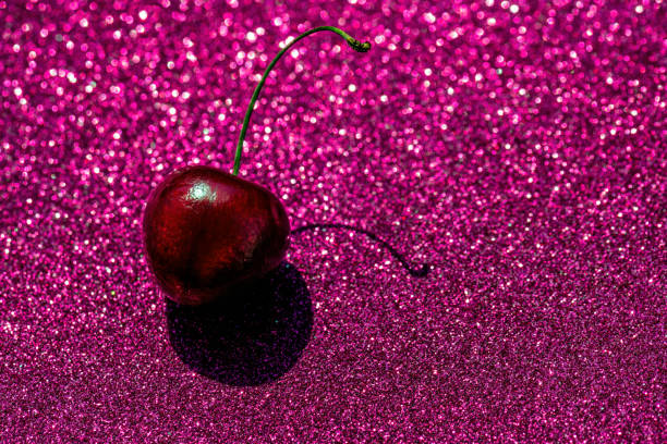Pink confetti background. Shiny grain texture. Glamour party effect pattern. Glowing noise glitter. Festive christmas glitter background.