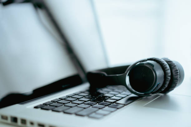 istock Wireless headphones and laptop 1327602925