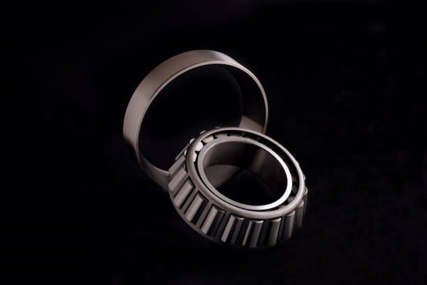 istock roller bearing on black background, blank for creativity close-up selective focus 1327603740