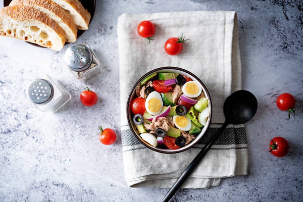 istock Canned Tuna red onion egg cucumber salad in a bowl 1327603882