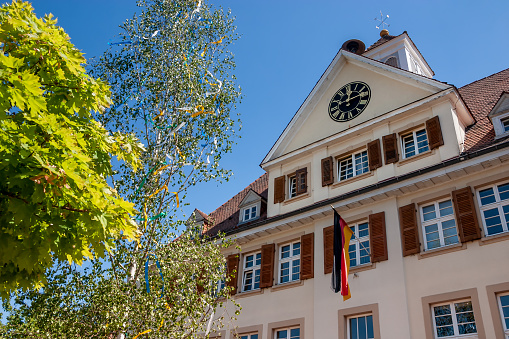 Old school house with maypole in Waldhilsbach, a small village near Heidelberg in Baden-Württemberg Germany