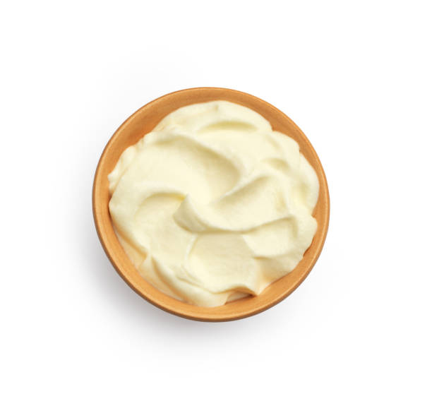 istock Creamy cream in a ceramic plate on a white background 1327608539