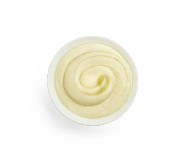 istock creamy cream in a white ceramic bowl, top view on a white background 1327608564