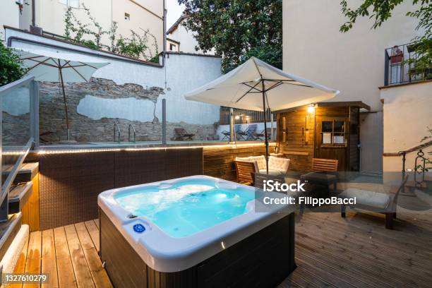 Tourist Resort With A Hot Tub And A Swimming Pool During Sunset Stock Photo - Download Image Now