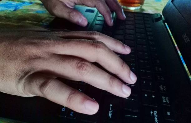 istock hands are pressing laptop keyboard keys 1327611046