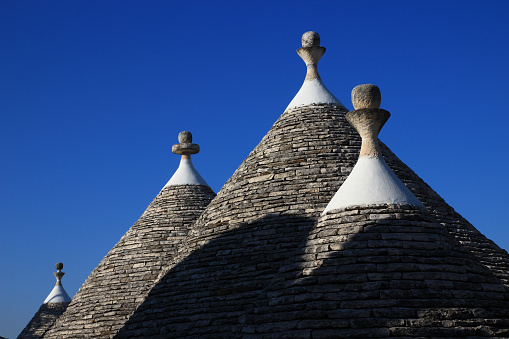 Four trulli roofs in the Monti district of Alberobello (Apulia, Italy)