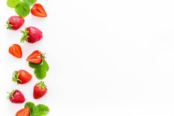 istock Red ripe strawberries with green leaves. Top view 1327612461