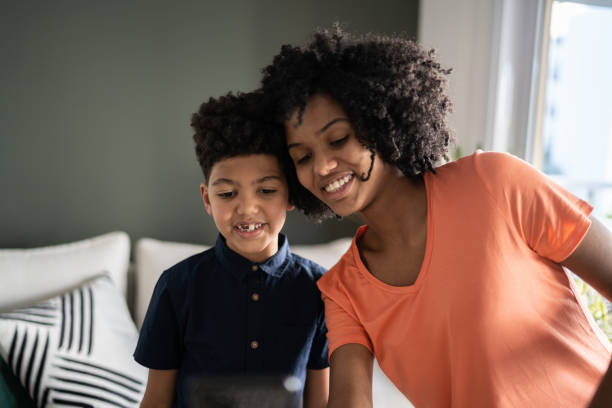 istock Siblings taking a selfie on mobile phone at home 1327612518