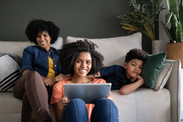istock Portrait of a family using digital tablet at home 1327612556