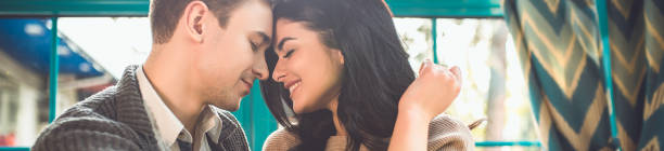 istock The cute couple sit in the restaurant 1327612645