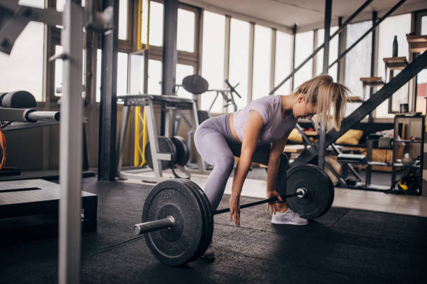 istock Young woman weightlifting 1327612709