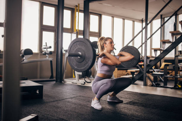 istock Young woman weightlifting 1327612769