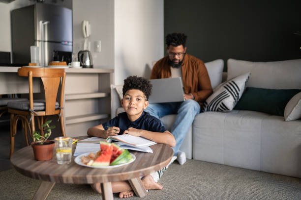 istock Portrait of a boy studying at home 1327612795