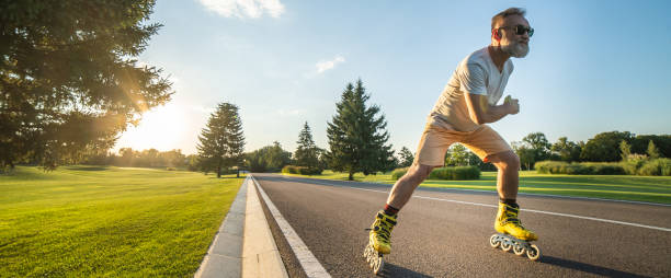 istock The old man in sunglasses rollerblading on the road 1327612882