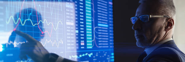 istock The man working on the big digital screen in the dark room 1327613063