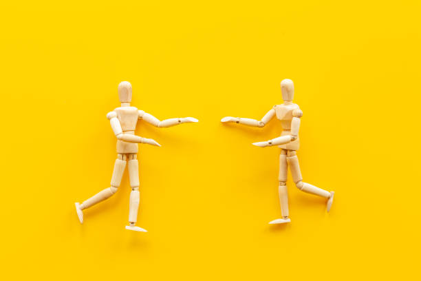 istock Two wooden figure connection - emotional communication concept 1327613219