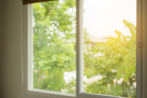 istock Abstract blur window interior with green garden view background 1327614165