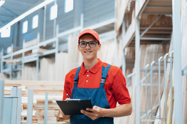 istock supervisor with a clipboard stands in a warehouse with a laminated board 1327614865