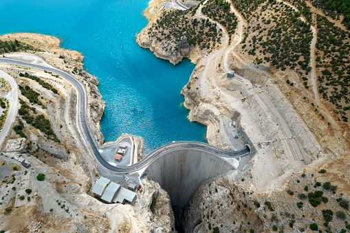 Aerial view of bridge on large dam