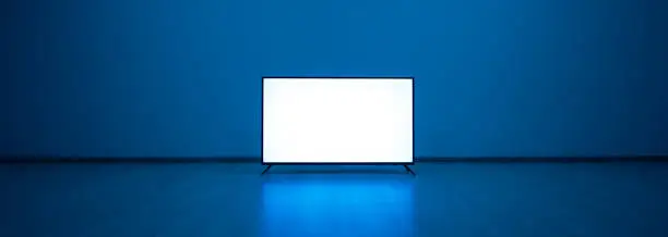 The television on the floor with a blue light background