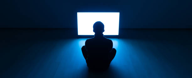 istock The man sitting on the floor and watching the television 1327616542
