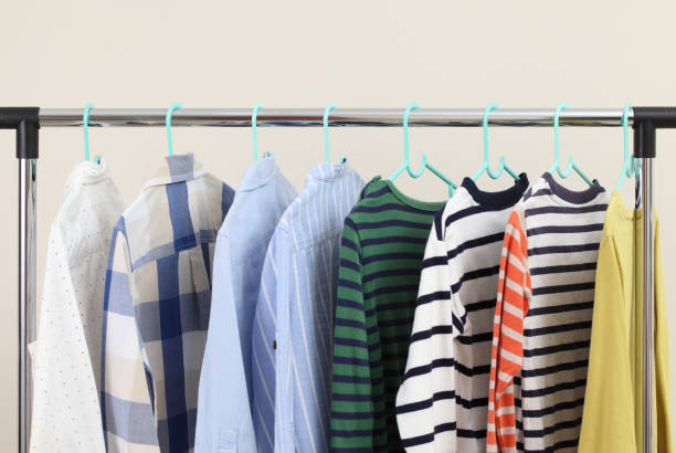 istock Pastel kid shirts hanging on rack in shop 1327617298